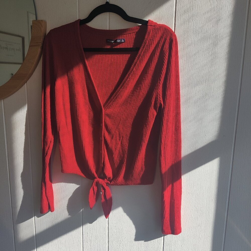 Abercrombie & Fitch Knit Top, tie at waist, long sleeved in soft red fabric.